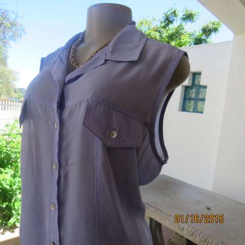 Sheer skyblue sleeveless top by TRUWORTHS size 42/18. Button down. Dummy pockets. As new.
