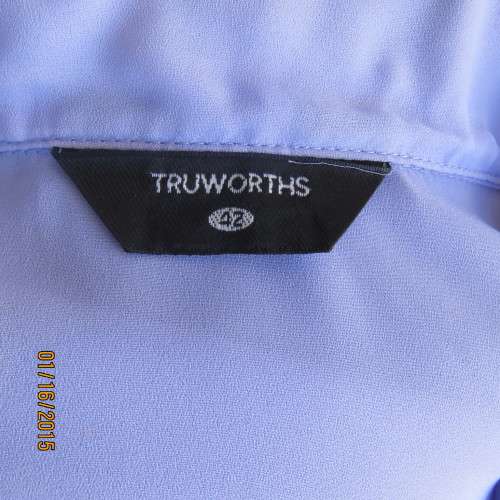 Sheer skyblue sleeveless top by TRUWORTHS size 42/18. Button down. Dummy pockets. As new.