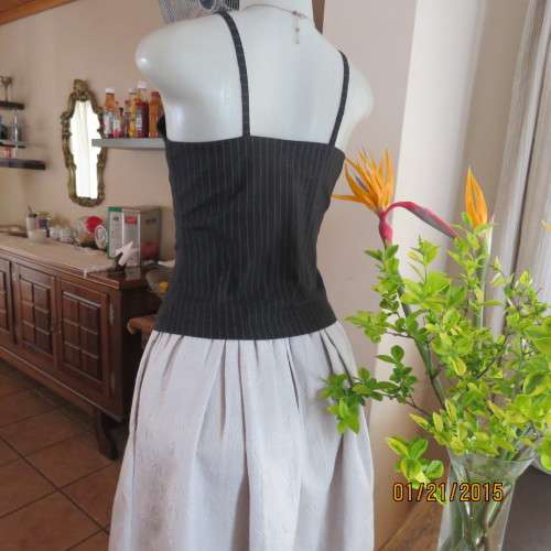 Cheeky black pinstripe tailored strappy top in poly/viscose stretch.Braiding on front.By URB size 32