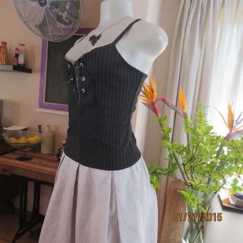 Cheeky black pinstripe tailored strappy top in poly/viscose stretch.Braiding on front.By URB size 32