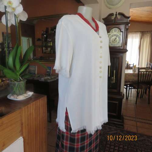 High quality light cream RAOUL size 40/16 long short sleeve top. Fringed hems. Partly button down.