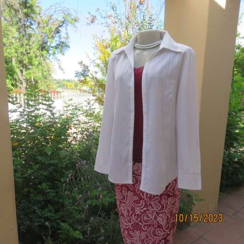 Smart white long sleeve polyester stretch top. Button down /open collar. Embossed stripes. Size 36.