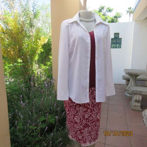 Smart white long sleeve polyester stretch top. Button down /open collar. Embossed stripes. Size 36.