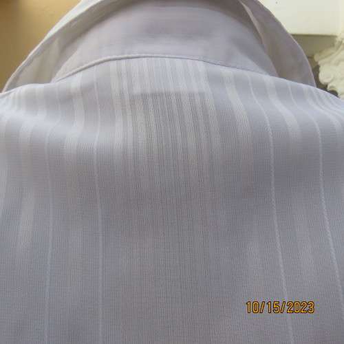 Smart white long sleeve polyester stretch top. Button down /open collar. Embossed stripes. Size 36.