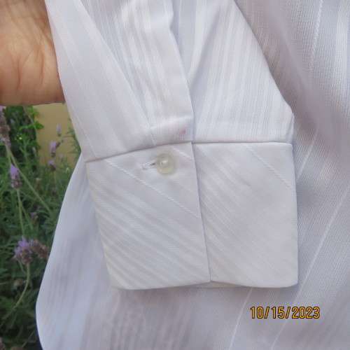 Smart white long sleeve polyester stretch top. Button down /open collar. Embossed stripes. Size 36.