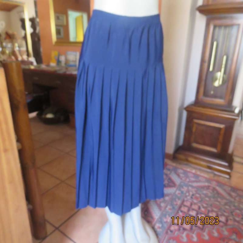 Ageless/easy to wear navy silky poly permanent pleated skirt. Wide yoke/elasticated waist.CAVIAR 36.