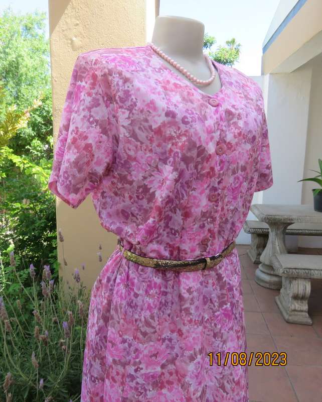 Beautiful textured silky poly dress with roses in pink shades. Size 40. Elasticated waist. As new.