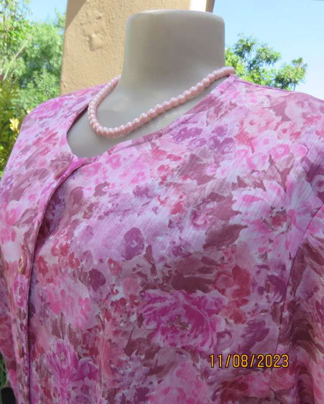 Beautiful textured silky poly dress with roses in pink shades. Size 40. Elasticated waist. As new.