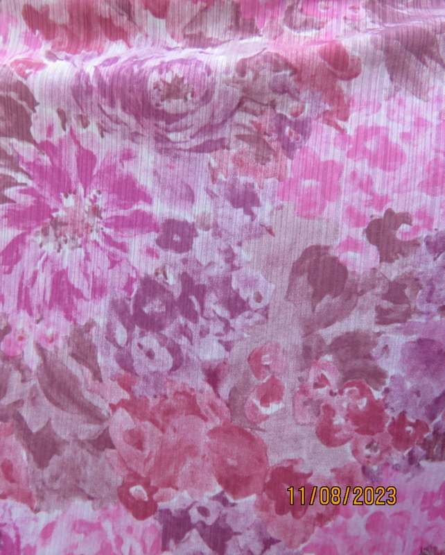 Beautiful textured silky poly dress with roses in pink shades. Size 40. Elasticated waist. As new.