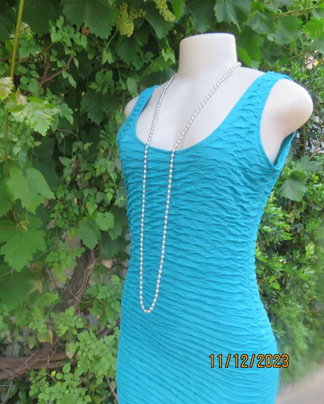 Sexy jade bodycon sleeveless dress in bubble stretch polyester .Round neckline.Size 34/10.A