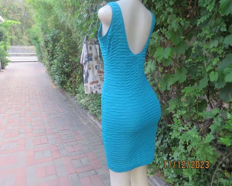 Sexy jade bodycon sleeveless dress in bubble stretch polyester .Round neckline.Size 34/10.A