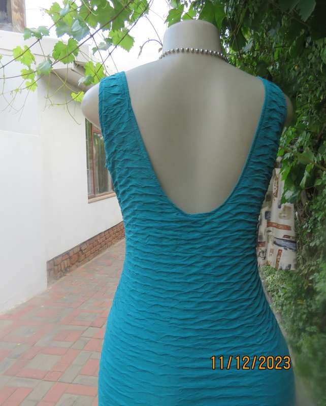 Sexy jade bodycon sleeveless dress in bubble stretch polyester .Round neckline.Size 34/10.A