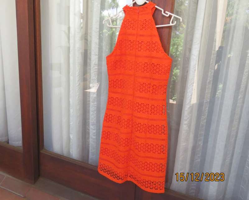 Outrageous orange sexy dress in heavy polyester lace/stretch poly lining. Size 30 by WOOLWORTHS.New