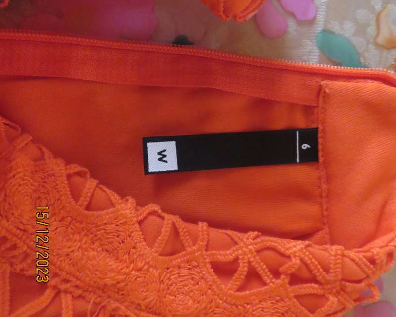 Outrageous orange sexy dress in heavy polyester lace/stretch poly lining. Size 30 by WOOLWORTHS.New