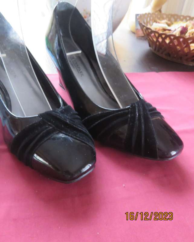 Pair of black shiny patent leather wedge heel shoes by QUEENSPARK size 5. Velvet crossovers.As new