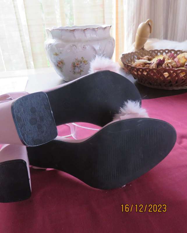 Pair of pale pink block heel sandals with ankle straps. Band over foot with faux fur.Size 5 by FIX.