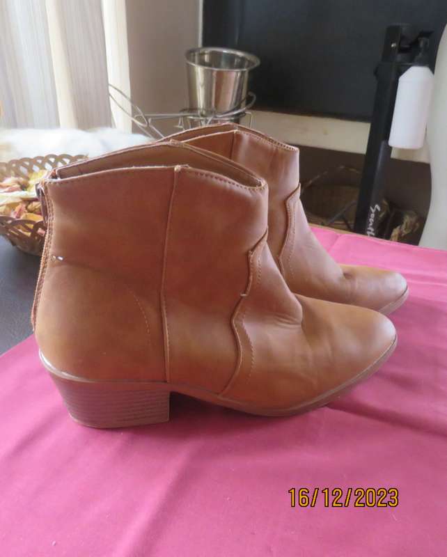 Pair of tan colour ankle boots size 6 by MRP. With comfy cuban heels. Zips at back. New condition