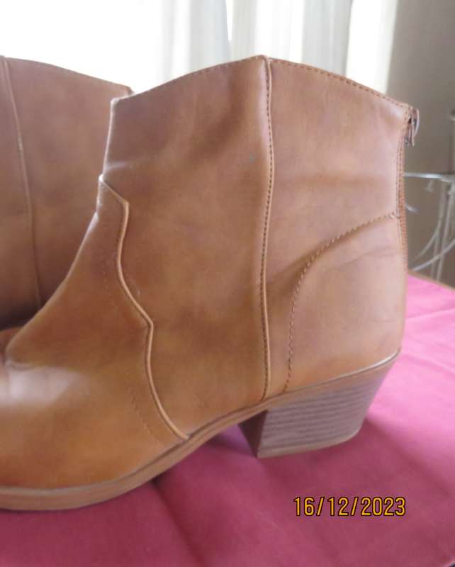 Pair of tan colour ankle boots size 6 by MRP. With comfy cuban heels. Zips at back. New condition
