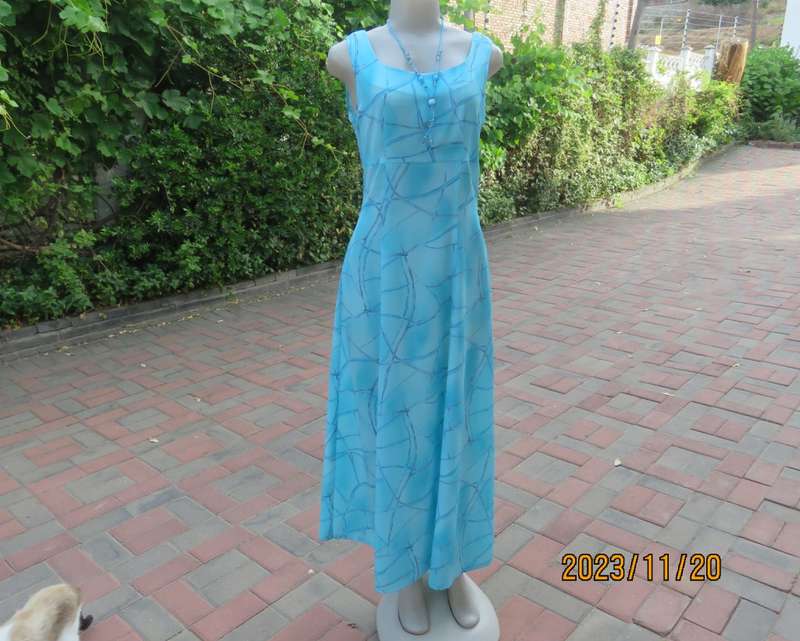 Turquoise maxi a-line dress with empire waist.Size 34/10..In textured polyester.Made by owner.As new