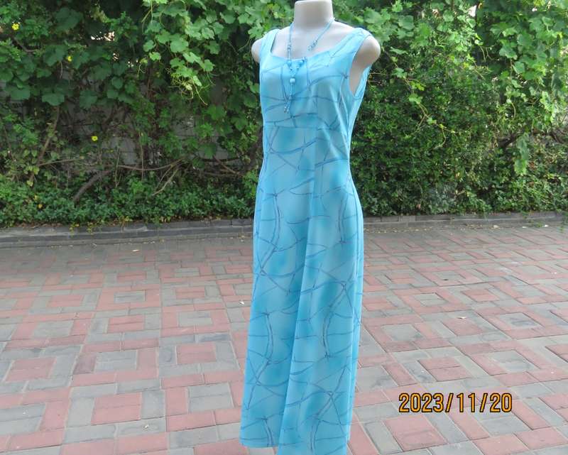 Turquoise maxi a-line dress with empire waist.Size 34/10..In textured polyester.Made by owner.As new