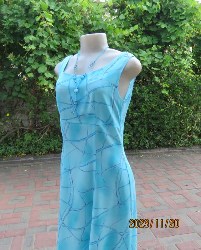 Turquoise maxi a-line dress with empire waist.Size 34/10..In textured polyester.Made by owner.As new