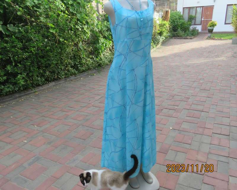 Turquoise maxi a-line dress with empire waist.Size 34/10..In textured polyester.Made by owner.As new
