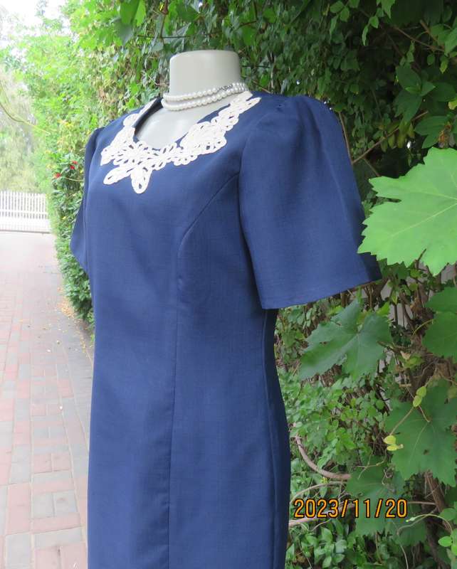 Elegant navy princess style short sleeve boutique made size 36/12 dress with U cream cord floral dec