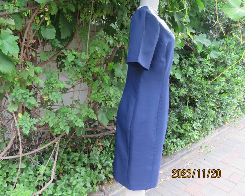 Elegant navy princess style short sleeve boutique made size 36/12 dress with U cream cord floral dec