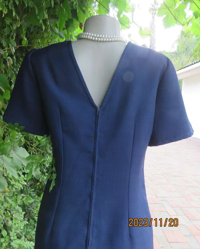 Elegant navy princess style short sleeve boutique made size 36/12 dress with U cream cord floral dec
