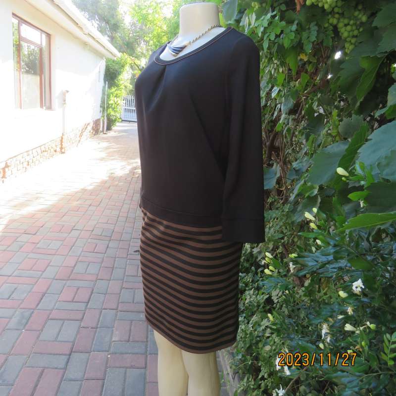 Elegant black jersey shift dress with black/brown striped bottom. Long sleeves. Size 34 from Korea.