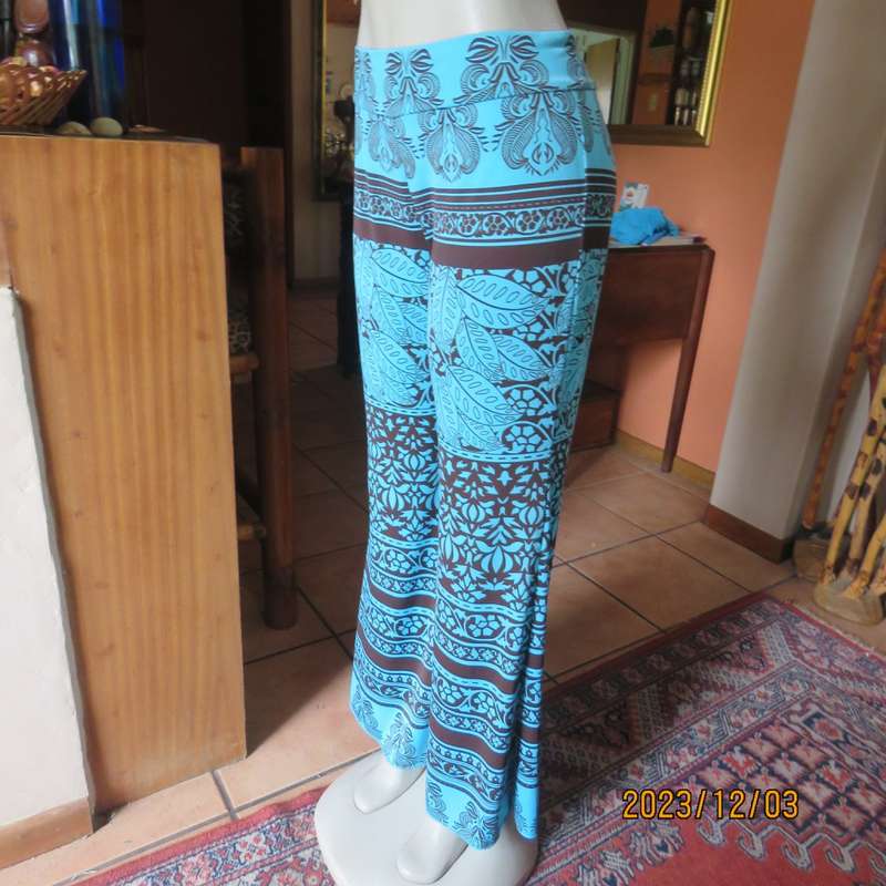 Striking comfy polyester stretch size 36 pants. Turquoise with brown baroque print. Bell bottoms.