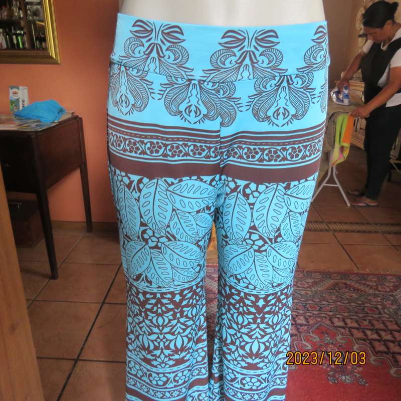 Striking comfy polyester stretch size 36 pants. Turquoise with brown baroque print. Bell bottoms.