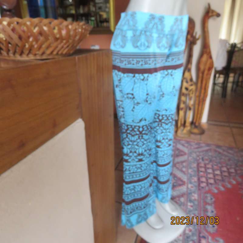 Striking comfy polyester stretch size 36 pants. Turquoise with brown baroque print. Bell bottoms.