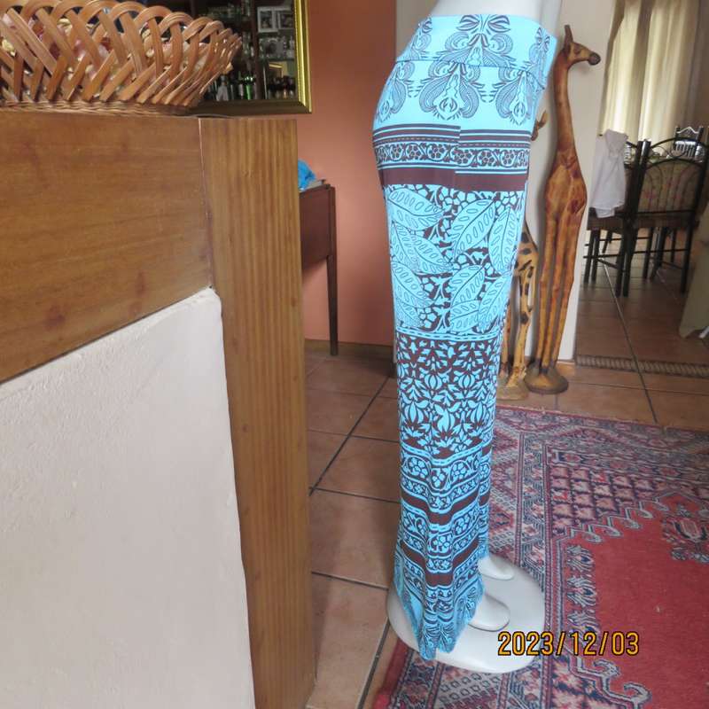 Striking comfy polyester stretch size 36 pants. Turquoise with brown baroque print. Bell bottoms.