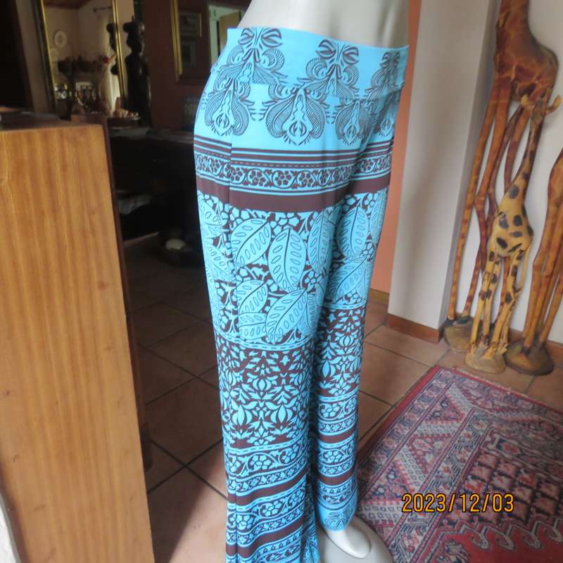 Striking comfy polyester stretch size 36 pants. Turquoise with brown baroque print. Bell bottoms.