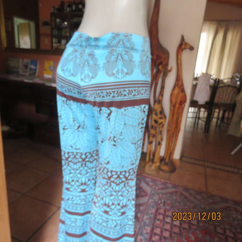Striking comfy polyester stretch size 36 pants. Turquoise with brown baroque print. Bell bottoms.