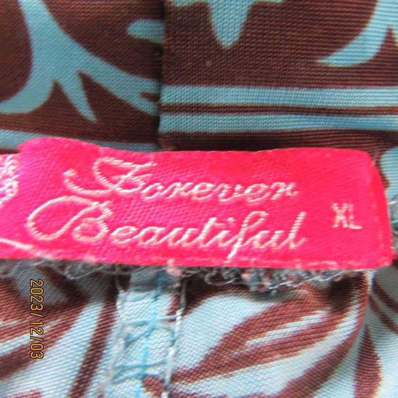 Striking comfy polyester stretch size 36 pants. Turquoise with brown baroque print. Bell bottoms.