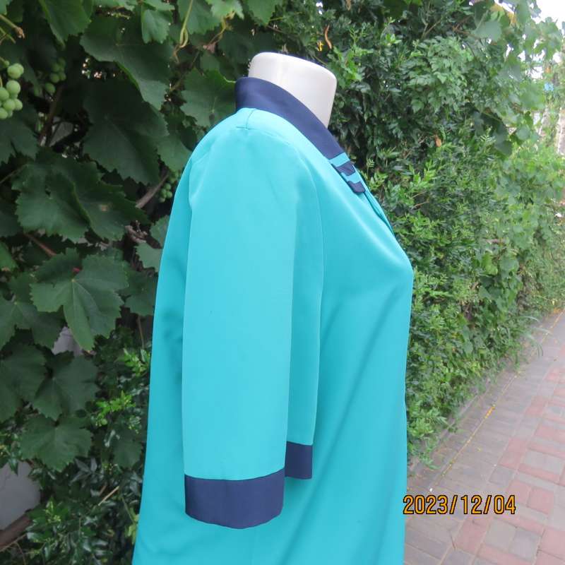 Beautiful jade silky polyester short sleeve top with navy open collar. By WOOLWORTHS size 38. As new