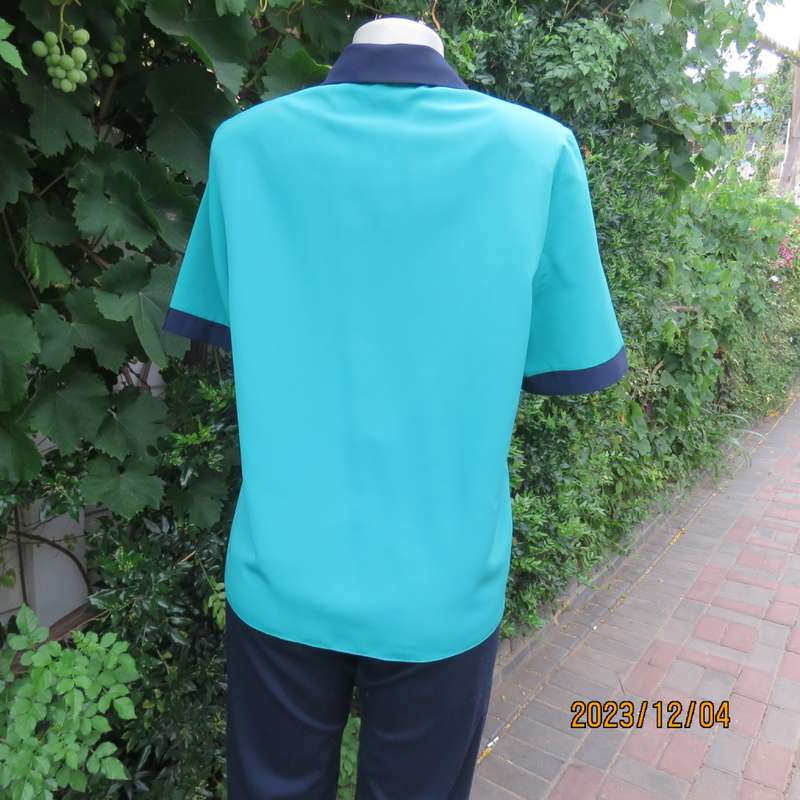 Beautiful jade silky polyester short sleeve top with navy open collar. By WOOLWORTHS size 38. As new