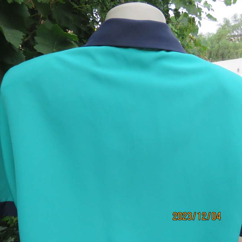 Beautiful jade silky polyester short sleeve top with navy open collar. By WOOLWORTHS size 38. As new