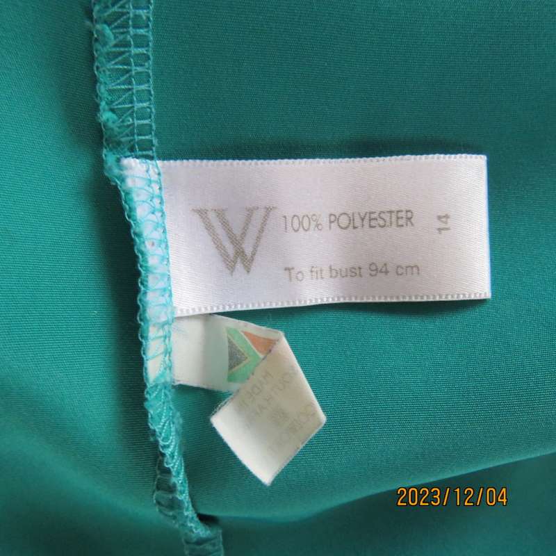 Beautiful jade silky polyester short sleeve top with navy open collar. By WOOLWORTHS size 38. As new