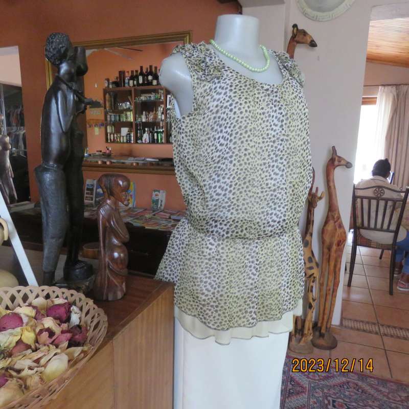 Pretty cool animal  print pale green/black blouson/peplum sheer poly/lined top. Size 36. As new.