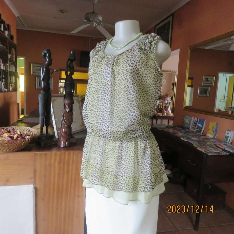 Pretty cool animal  print pale green/black blouson/peplum sheer poly/lined top. Size 36. As new.