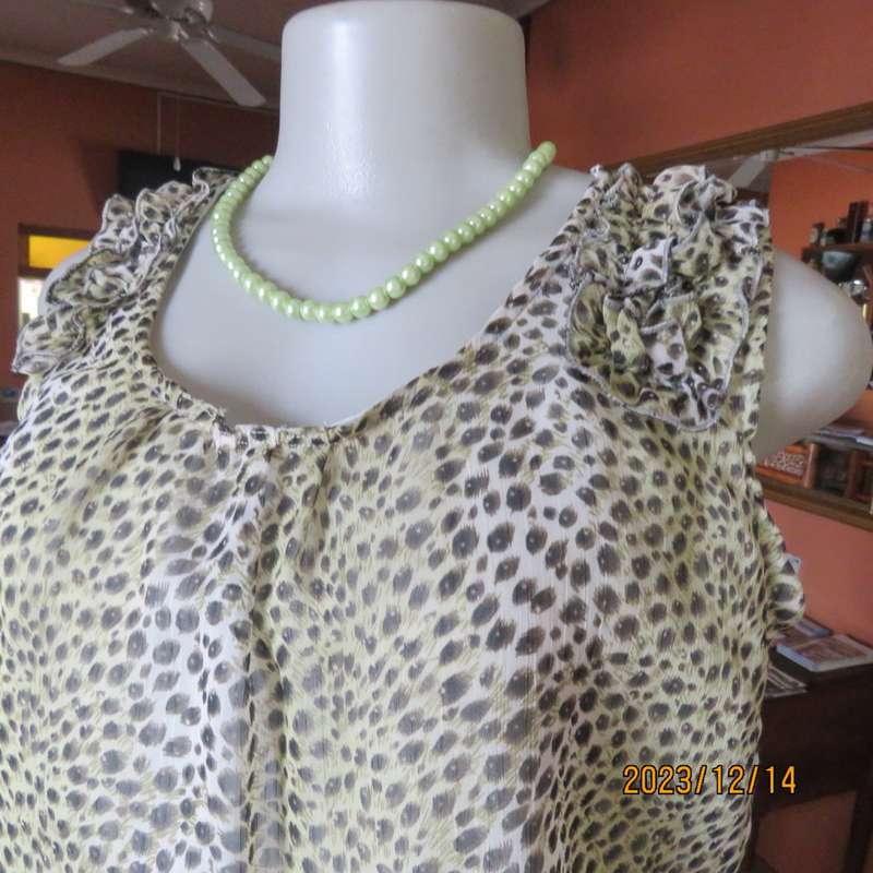 Pretty cool animal  print pale green/black blouson/peplum sheer poly/lined top. Size 36. As new.