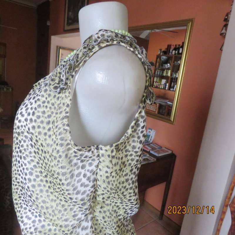 Pretty cool animal  print pale green/black blouson/peplum sheer poly/lined top. Size 36. As new.