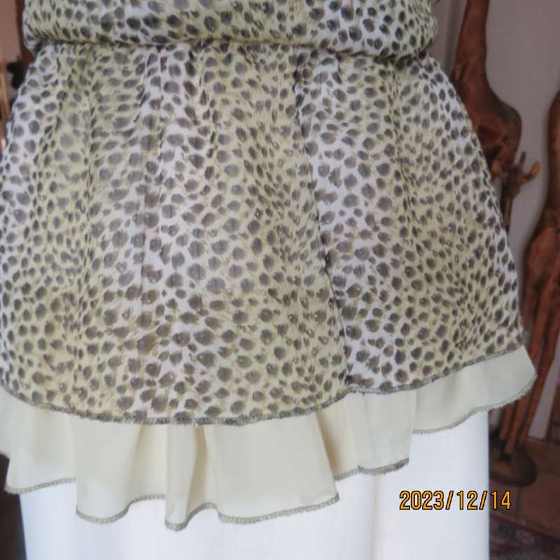 Pretty cool animal  print pale green/black blouson/peplum sheer poly/lined top. Size 36. As new.