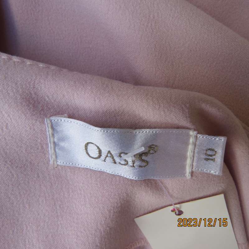 Stunning pale pink stretch poly/viscose skirt by OASIS size 34/10. Unique side panels, Brand new con