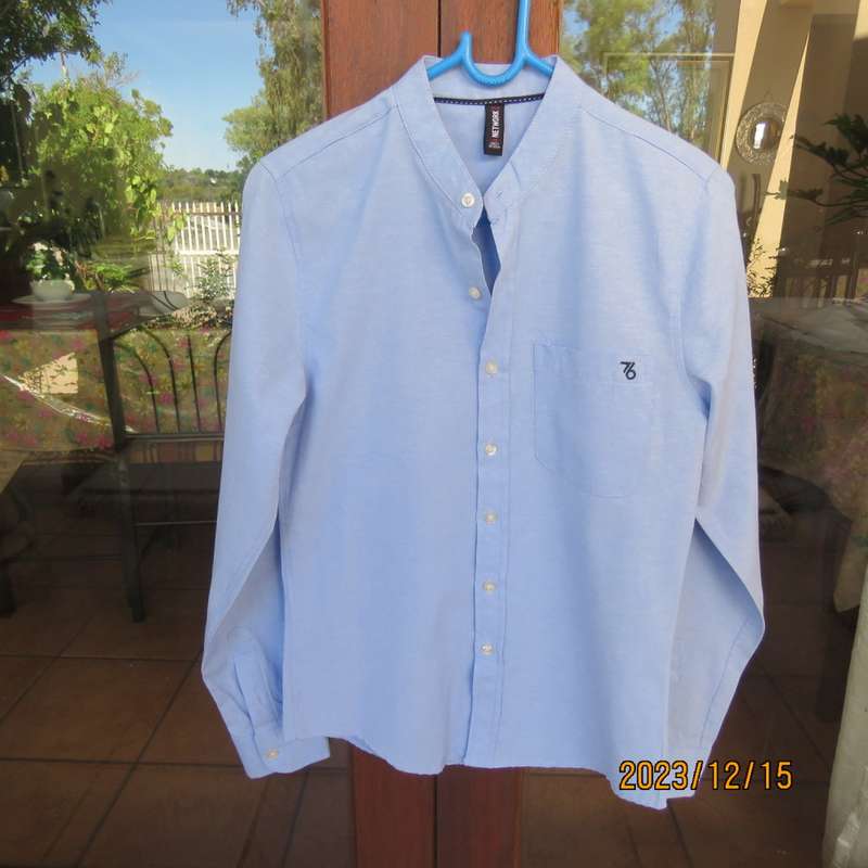 Brand new men`s sky blue long sleeve/high collar polycotton shirt size XS by NETWORK. Chest 84 -89cm