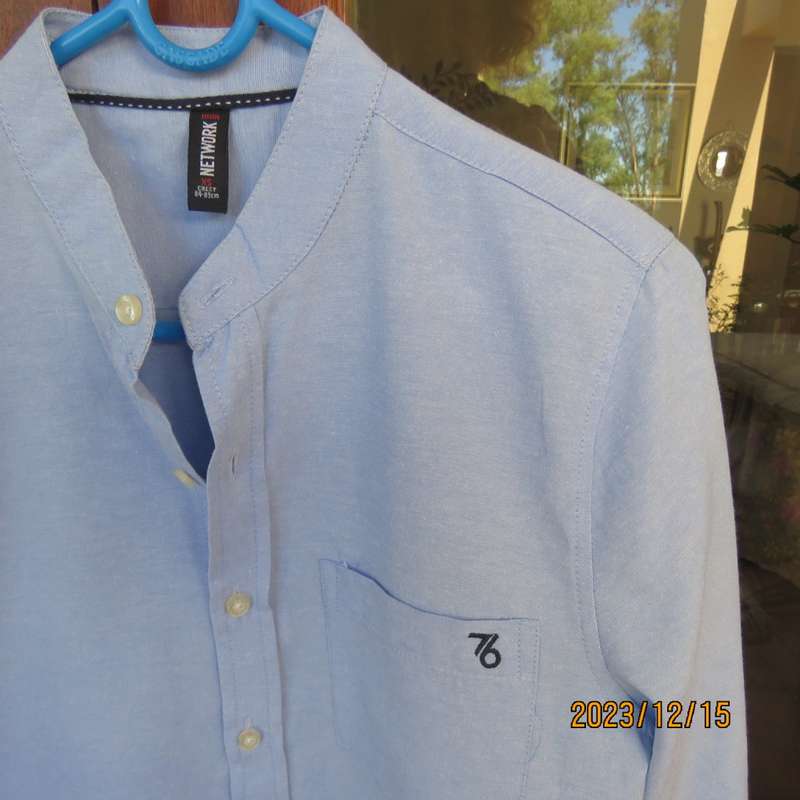Brand new men`s sky blue long sleeve/high collar polycotton shirt size XS by NETWORK. Chest 84 -89cm