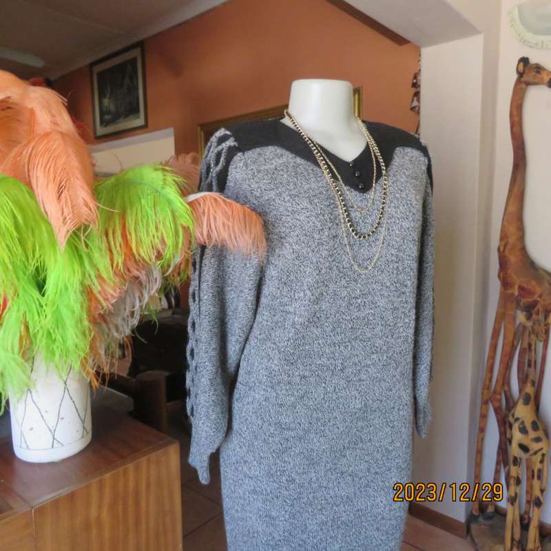 Go for effortless style. Wool/acrylic/cotton blend low calf  knitted dress. By FUJIKI size 34.As new